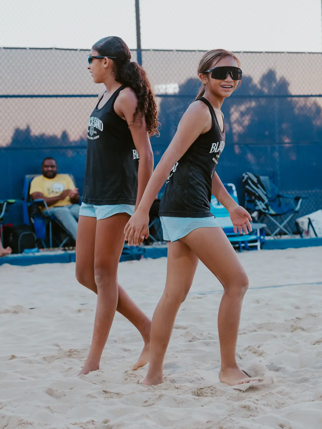 Two players walk back between points