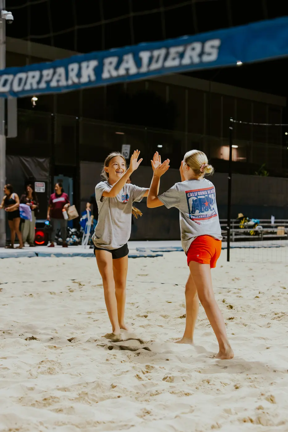 Two players share a laugh between points
